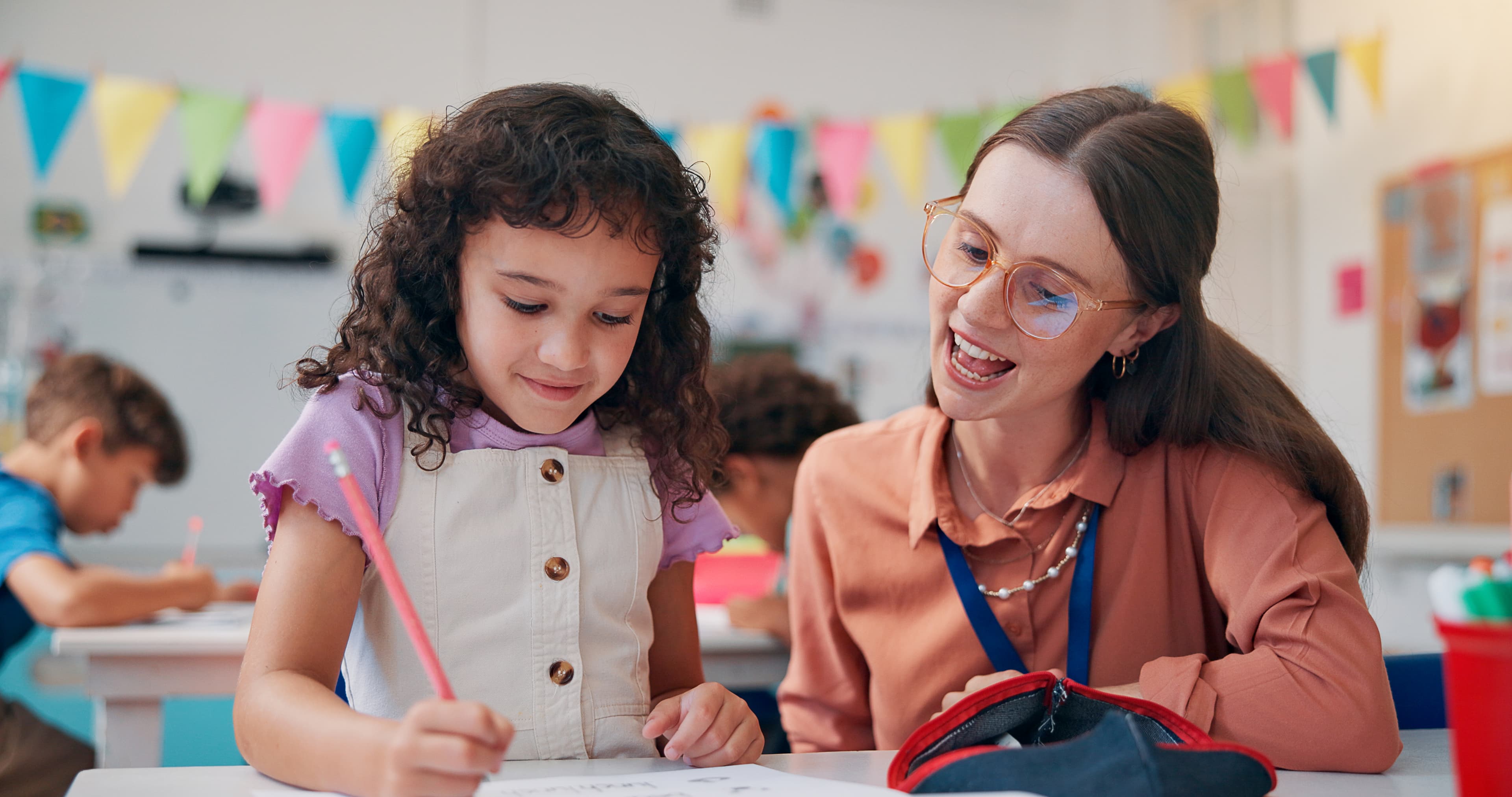 Young students reading a book together